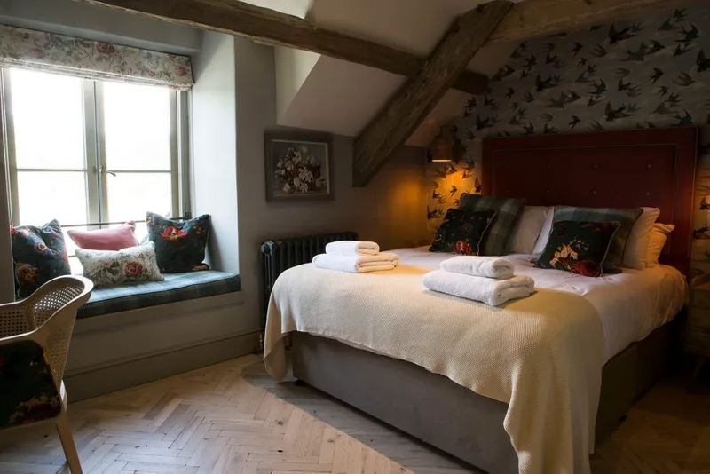An image of a room with a bed in it