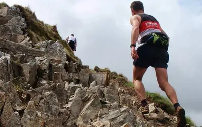 Someone climbing rocky terrain